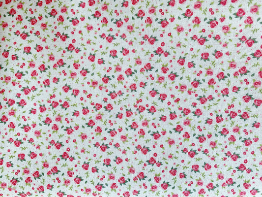 TELA INFANTIL ESTAMPADO FLORES DE 1,50 DE ANCHO. 15 EUROS/ METRO.